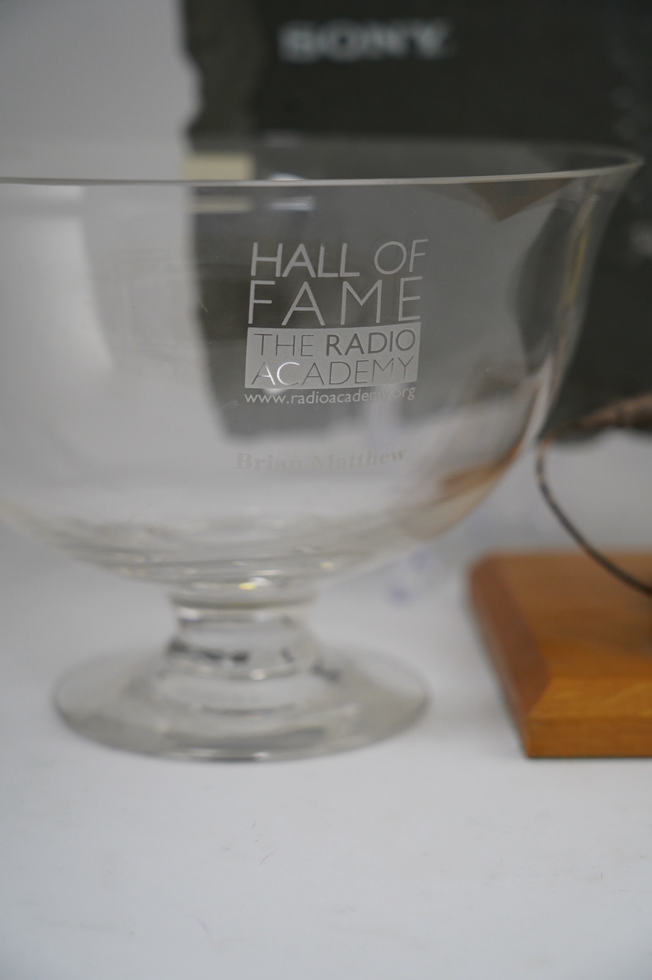 Five radio awards presented to Brian Matthew including; three Sony Radio Awards for 1988, 1996 and 2008, a glass pedestal bowl etched with the Radio Academy Hall of Fame Brian Matthew, and a Radio Academy recognition of